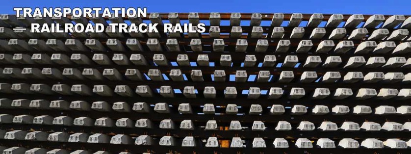 Railroad Rails Stacked in Manufacturing Yard